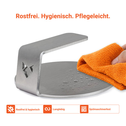 Die Infografik zeigt, dass der FENNEK Burger Smasher rostfrei, hygienisch und pflegeleicht ist. Entweder man wischt den Smasher mit einem feuchten Tuch ab oder packt ihn in die Spülmaschine.